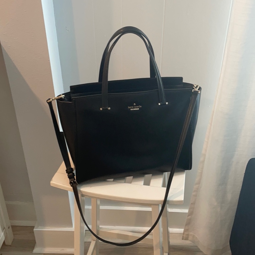 Kate Spade ;Gently used leather -**note that the interior pocket has a stain.